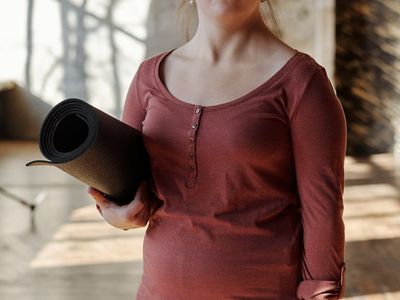 An empty, serene room with a yoga mat, ready for practice.